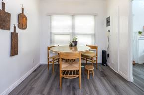 Beverly Hills triplex for rent - a dining area with a wooden table and four chairs
