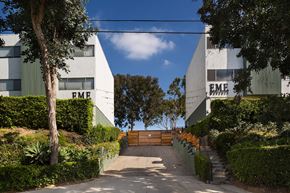 Los Angeles apartment for rent - a path between two buildings with trees and a fence