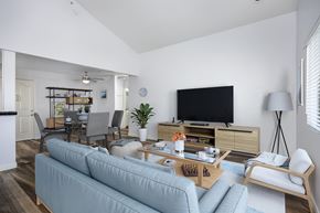 Torrance apartment for rent - A living room with a grey couch and a television.