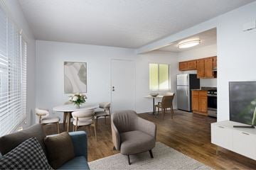 Torrance apartment for rent - A living room with a grey armchair and a white sofa.