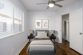 Torrance apartment for rent - A bedroom with a bed, two lamps, and a ceiling fan.