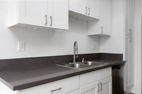 Los Angeles apartment for rent - a kitchen with white cabinets and a sink