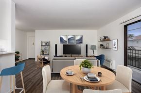Los Angeles apartment for rent - A modern dining room with a wooden table and chairs.