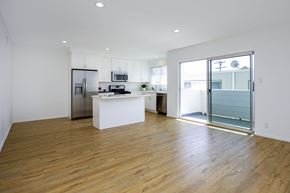Beverly Hills apartment for rent - a living room with a kitchen and a sliding glass door