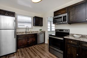 Los Angeles apartment for rent - a kitchen with stainless steel appliances and wooden cabinets