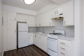 Van Nuys apartment for rent - a kitchen with white appliances and white cabinets