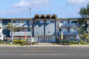 Van Nuys apartment for rent - a large building with a street in front of it