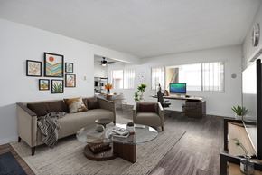 Inglewood apartment for rent - A living room with a couch, a coffee table, and a TV.