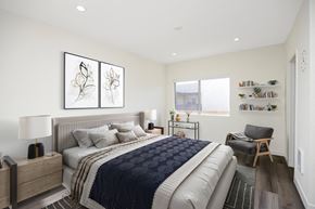 Redondo Beach apartment for rent - A bedroom with a large bed and a chair.