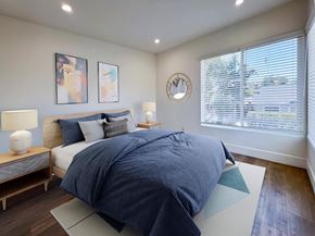 Los Angeles apartment for rent - a bedroom with a bed and a large window