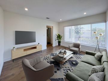 Los Angeles apartment for rent - a living room with a couch and chairs and a television
