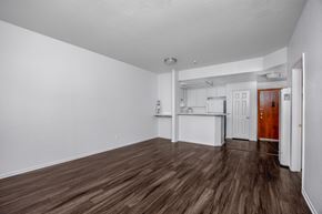 Hawthorne apartment for rent - A room with white walls and brown flooring.