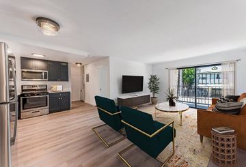 Los Angeles apartment for rent - A modern living room with a green sofa and a television.