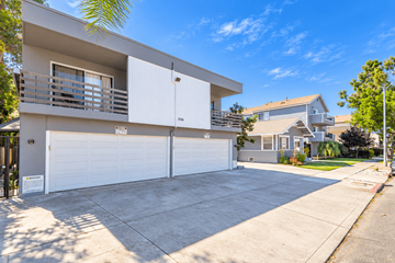 Long Beach apartment for rent - A modern two-story house with a white garage door.