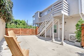 Los Angeles apartment for rent - the patio of a house with stairs and a wooden bench