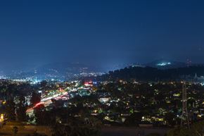 Los Angeles apartment for rent - a view of a city at night from a hill