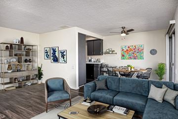 Redondo Beach apartment for rent - A living room with a blue couch and a chair.