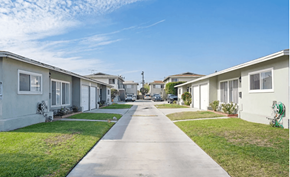 Gardena apartment for rent - a row of houses on a street with a clear blue sky in the background