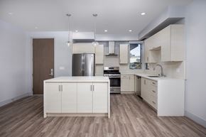 Los Angeles apartment for rent - a kitchen with white cabinets and stainless steel appliances