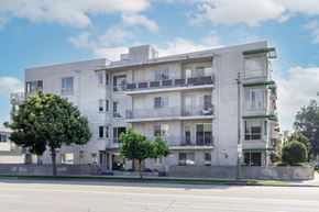 Los Angeles apartment for rent - a white apartment building on the corner of a street