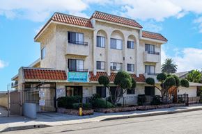 Hawthorne apartment for rent - a house with a fence and a street in front of it