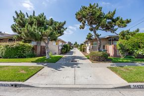 Gardena apartment for rent - a street with houses on either side of a sidewalk