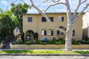 Los Angeles apartment for rent - a yellow house with a tree in front of it