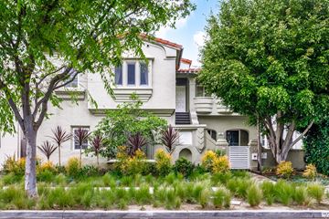 Beverly Hills apartment for rent - A white house with a red roof and a tree in front.