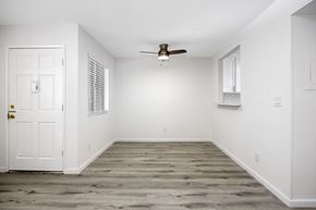 Los Angeles apartment for rent - an empty room with white walls and a ceiling fan