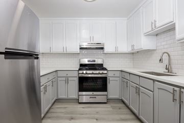 Los Angeles apartment for rent - a white kitchen with white cabinets and stainless steel appliances
