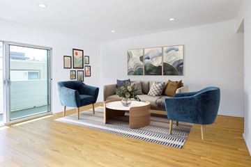 Beverly Hills apartment for rent - a living room with a couch and two chairs and a rug