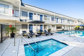 Sherman Oaks apartment for rent - A pool area with a small pool and lounge chairs.