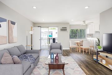 West Hollywood apartment for rent - a living room and dining room with couches and a table