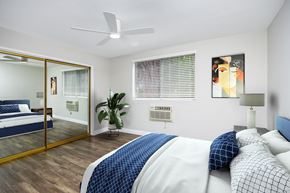 West Hollywood apartment for rent - a bedroom with a large bed and a mirror