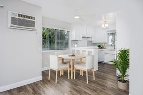 West Hollywood apartment for rent - a dining room with a table and chairs and a kitchen