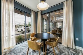 Austin townhouse for rent - A dining room with a round table and chairs.
