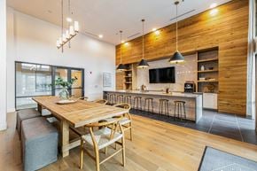 Austin townhouse for rent - A modern kitchen with a wooden table and chairs.