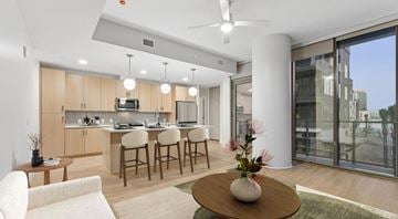 Las Vegas apartment for rent - A modern kitchen with a dining table and chairs.