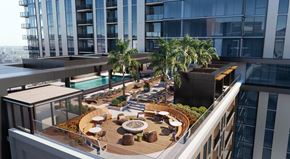 Las Vegas apartment for rent - A rooftop patio with a pool and seating area.