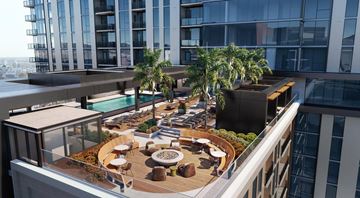 Las Vegas apartment for rent - A rooftop patio with a pool and seating area.
