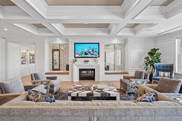 Charleston apartment for rent - A living room with a fireplace and a television on the wall.