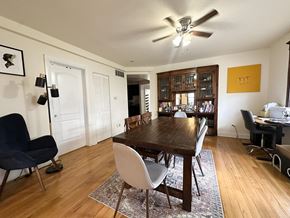 Chicago apartment for rent - A dining room with a wooden table and chairs.