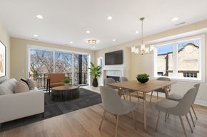 Chicago apartment for rent - A modern dining room with a wooden table and chairs.