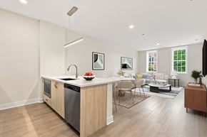 Chicago apartment for rent - A modern kitchen with a wooden island and stainless steel appliances.