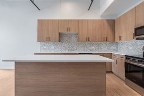 Chicago apartment for rent - A kitchen with wooden cabinets and a countertop.