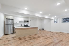 Chicago apartment for rent - A kitchen with a refrigerator, microwave, and oven.