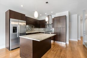Chicago apartment for rent - A modern kitchen with a center island and stainless steel appliances.