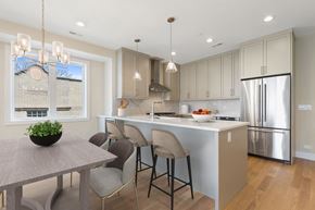 Chicago apartment for rent - A modern kitchen with a dining table and chairs.