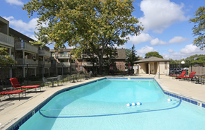 Buffalo Grove apartment for rent - our apartments have a large pool with chairs and a tree