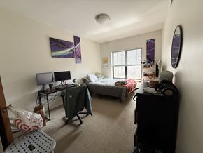 Chicago apartment for rent - A bedroom with a bed, desk, and chair.